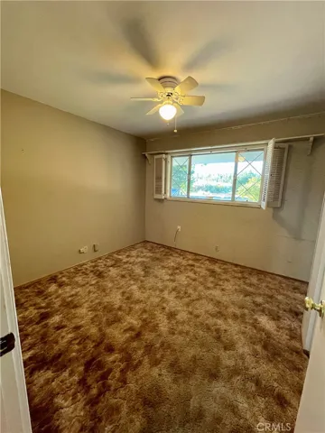 Front Bedroom/Office (with old carpet)