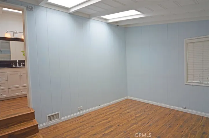 The primary bedroom with two operable skylights.