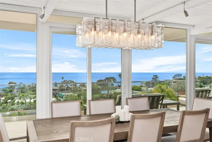 Dining area looking out to upper deck and Pacific Ocean.