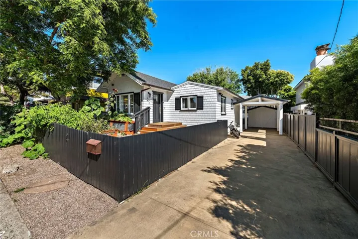 Long Driveway fits 3/4 cars with single car garage at end currently being used as an office.