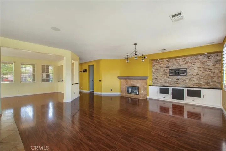 Another View of Family Room Wood Floors, Gas Fireplace and Entertainment Center