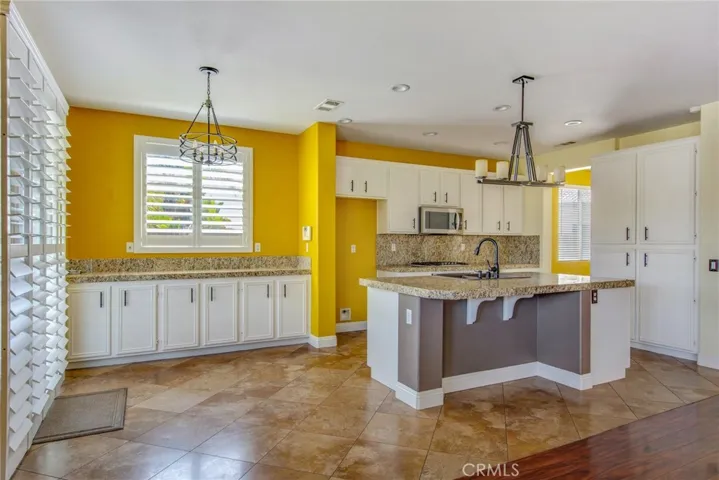Another view of Kitchen, Island, Breakfast Bar from Family Room
