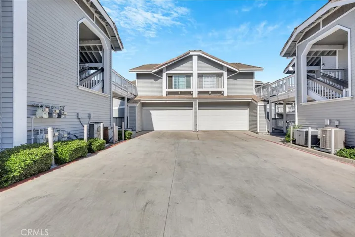 Front of home on the left. Attached Garage with Direct Access to Home.