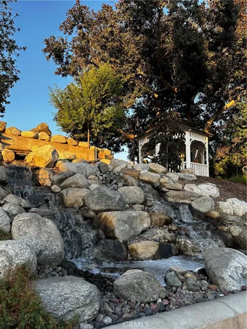 Waterfalls by gazebo behind pool