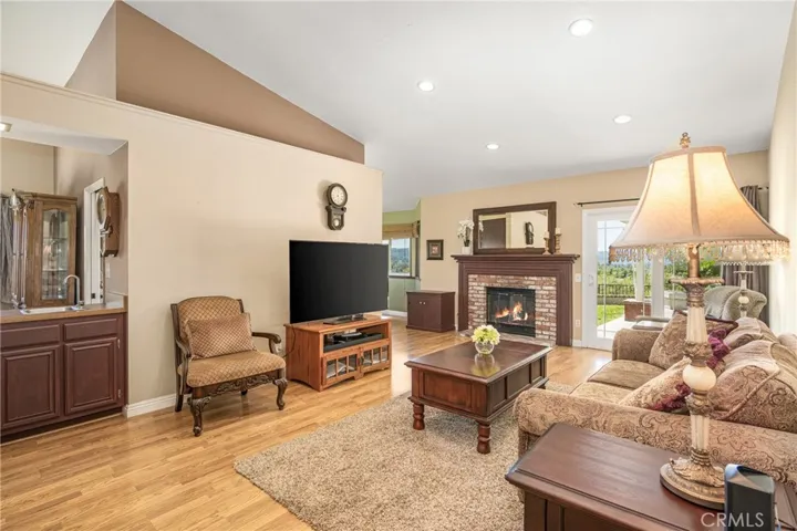 Family room with fireplace and entrance to back yard