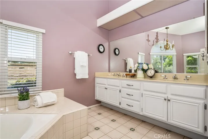 Primary bathroom with view of double sinks