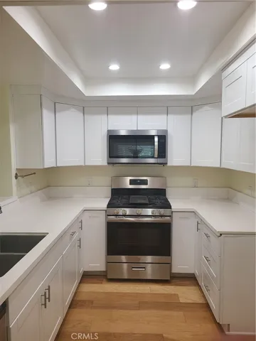 New upper cabinets, canned lighting and stainless Microwave !