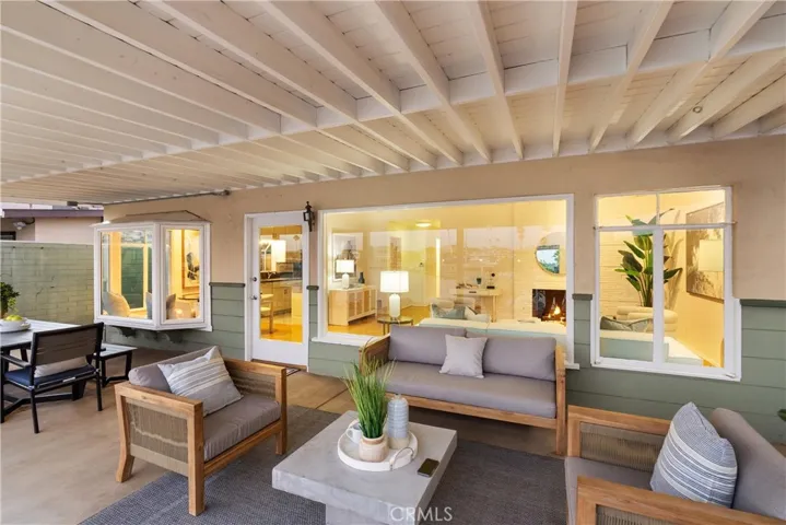The covered patio is perfect for seaside relaxation