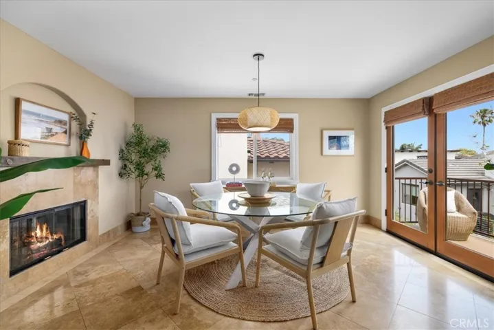 Dining room w/french doors leading to outdoor balcony