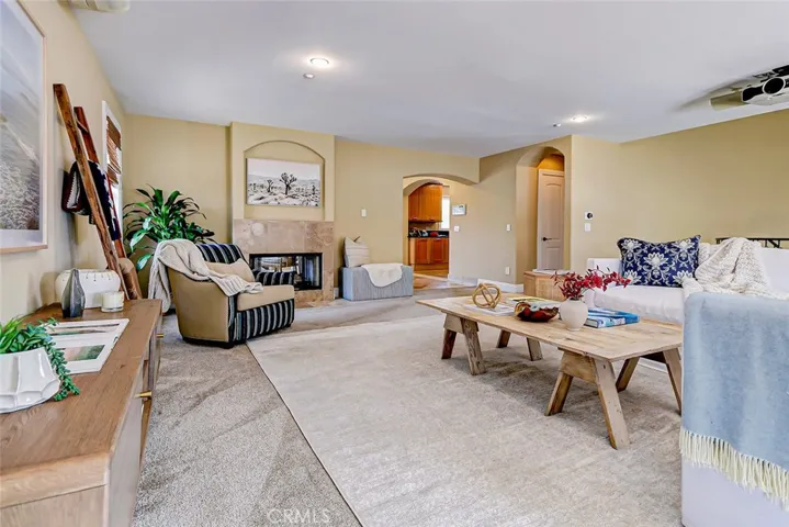 Large living room with dual sided fireplace shared with dining room