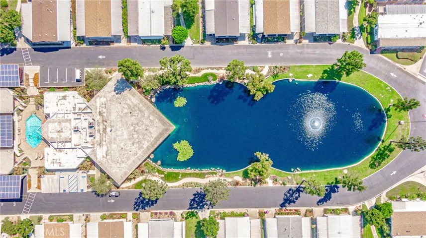 Arial view of 2 of 2 pools and lake