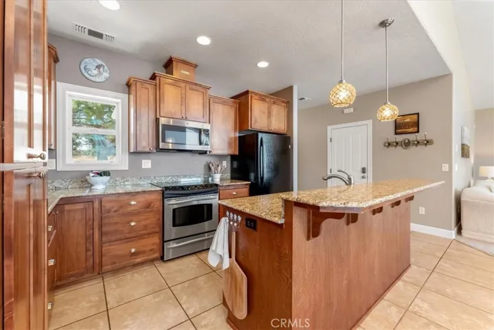 Open kitchen with granite countertops and plenty of storage!