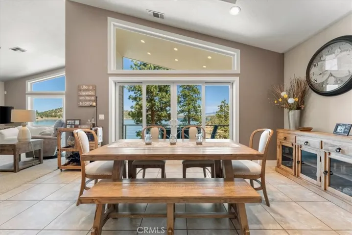 Lake and trees provide a tranquil backdrop for dining.