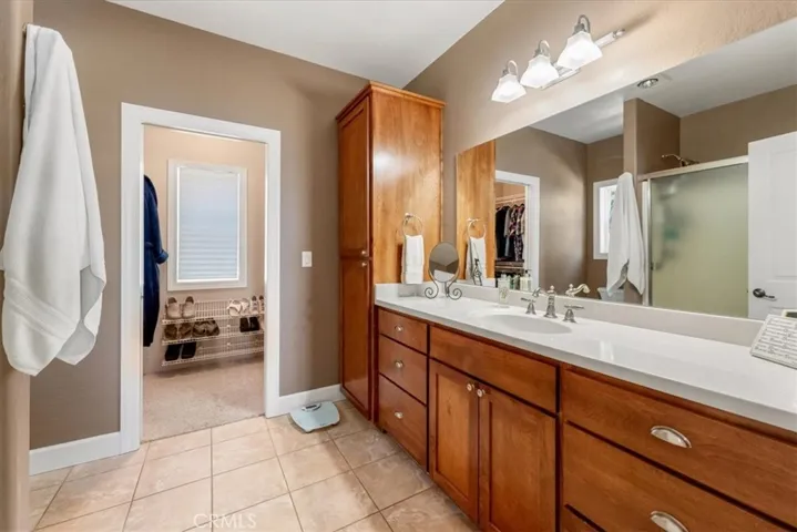 Primary bathroom with walk-in-closet.