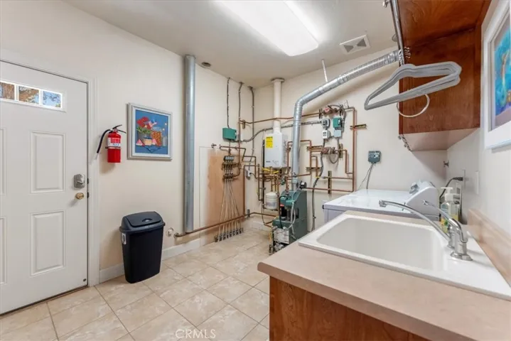 Laundry room conveniently equipped with a sink for cleaning all the fish you catch for dinner!