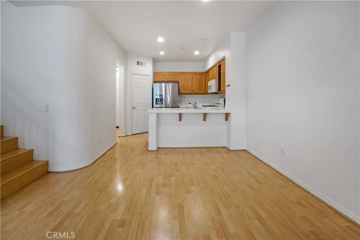 Spacious, open entrance with high ceilings, recessed lighting and a warm welcome to a cohesive community.