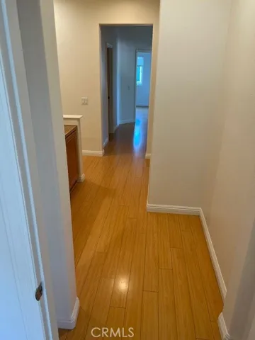Hallway view into 3 Guest Bedrooms with Mirrored Wardrobes