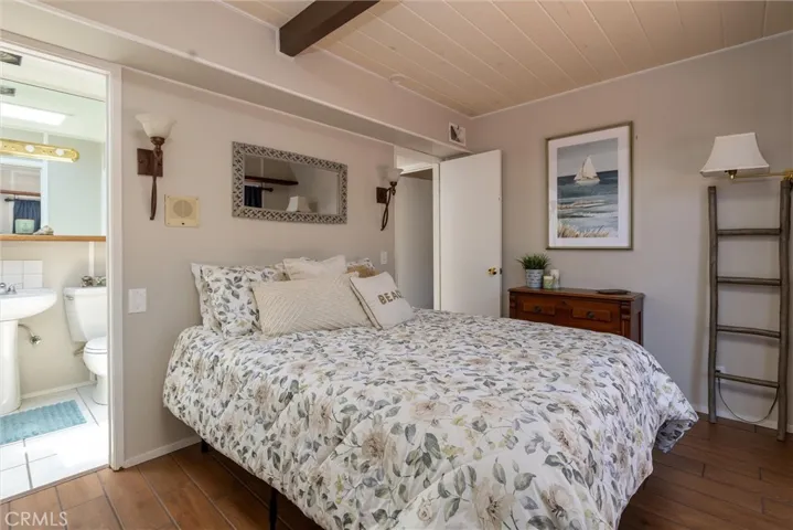 Third bedroom, attached J & J bathroom, with additional access from the hall and to the dining room. Glass slider opens to the back patio.