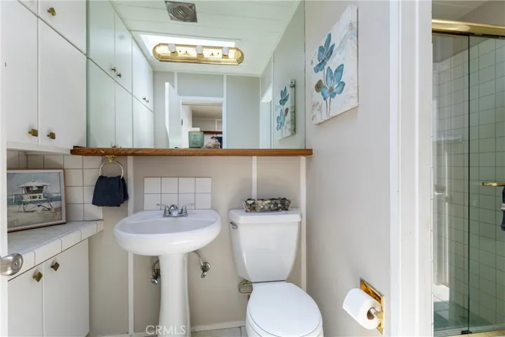 Jack N Jill bathroom with step in shower with access from the hall and the 3rd bedroom