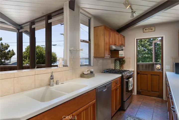 Large Galley Kitchen with a Dutch door and lots of storage and light