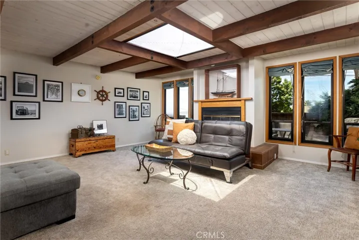  Spacious family room, light and bright with skylights, a gas starter fireplace and water views!