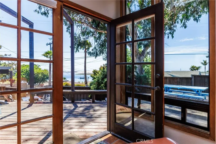 A beautiful view from the primary suite looking to the ocean and the front outdoor patios