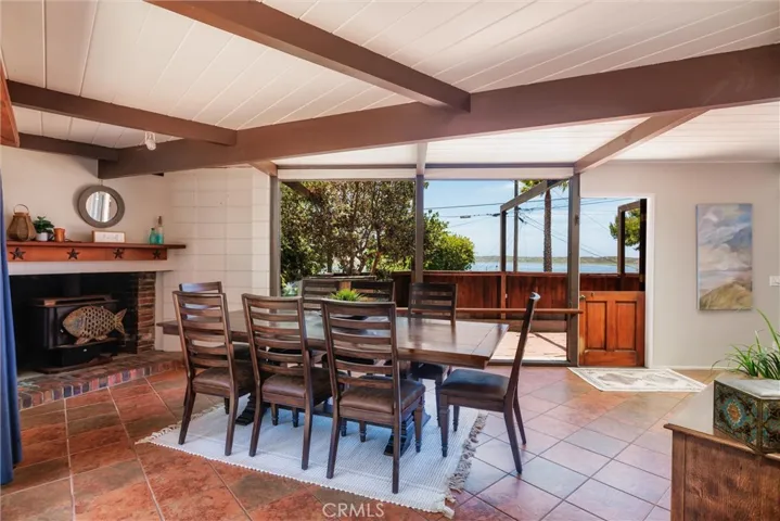  The Living/ Dining room, Post and Beam construction, and windows to enjoy the constant water views