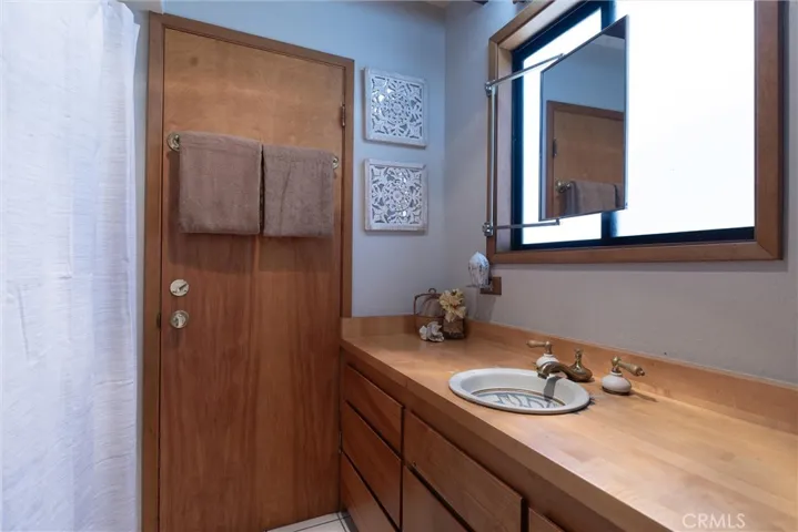 Primary Bathroom with tub over shower and access to the mud room and the front and side patios.