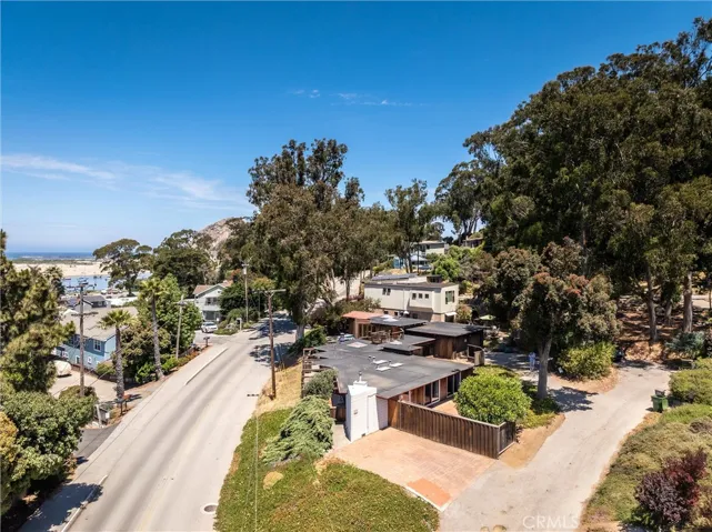 The circle drive is a city street with 2 parking areas = 4 exterior spots.  1 in front on the cement pad and 1 at the back driveway with access to the large garage. 2 additional driveway parking spots inside if needed.