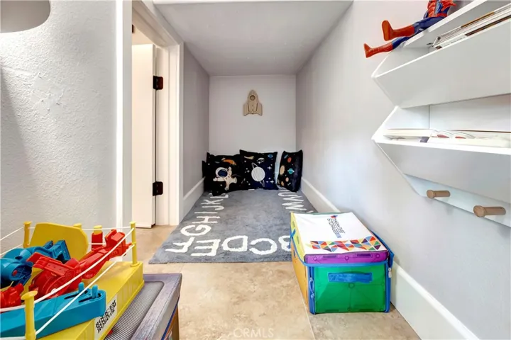 This is a room we call a hidey-hole. storage under the stairs turned into a 4 year olds little play room.