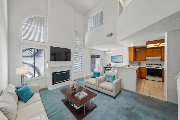 Virtually staged family room with gas fireplace