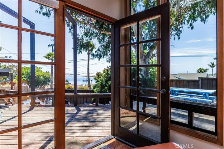 A beautiful view from the primary suite looking to the ocean and the front outdoor patios
