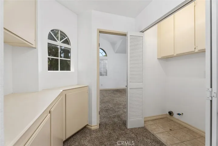 Laundry space in the hallway connecting the upstairs bedrooms