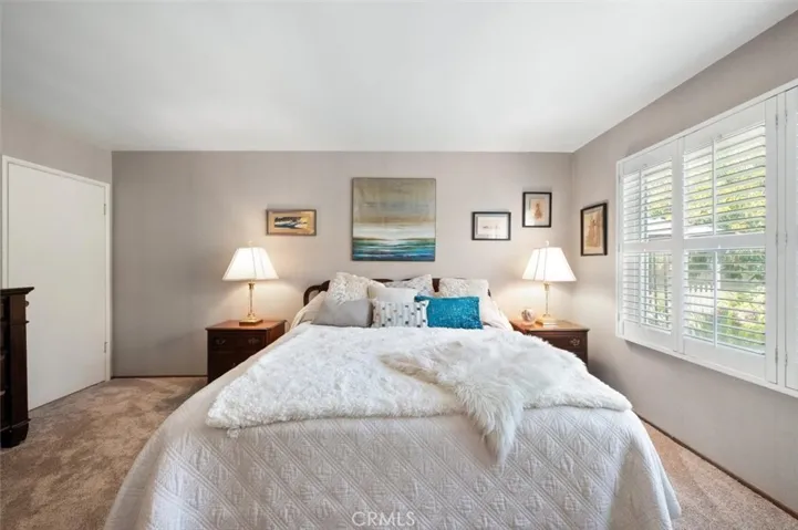 King sized bed. Wood floors under new carpet.