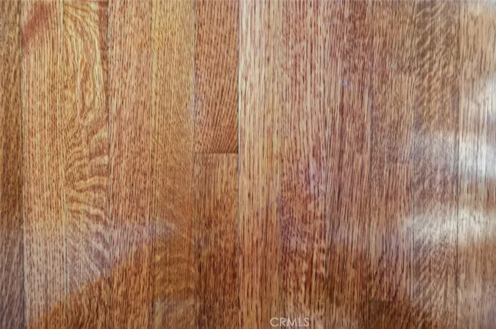 Original red oak floors refinished in most rooms.