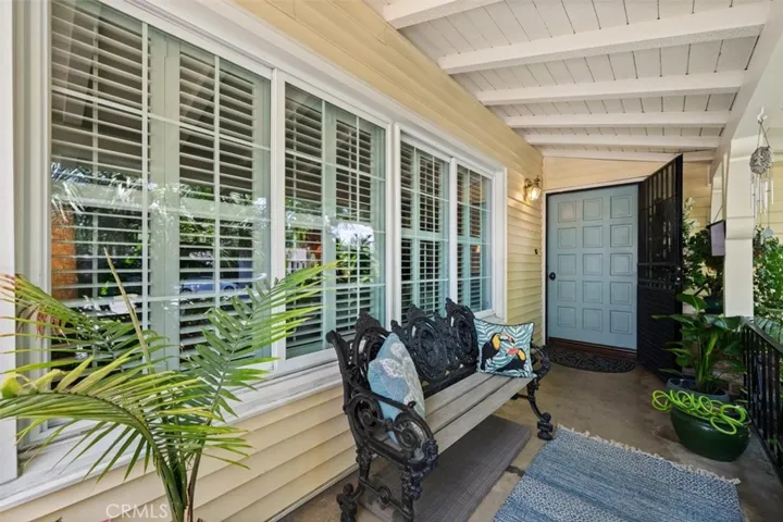 Shady front porch and new dual pane windows.