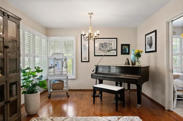 Dining area is used for the beautiful piano.
