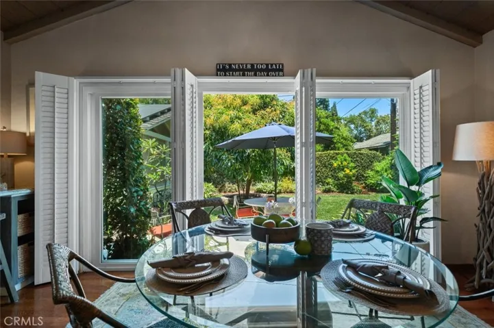 Triple sliding glass door to backyard.