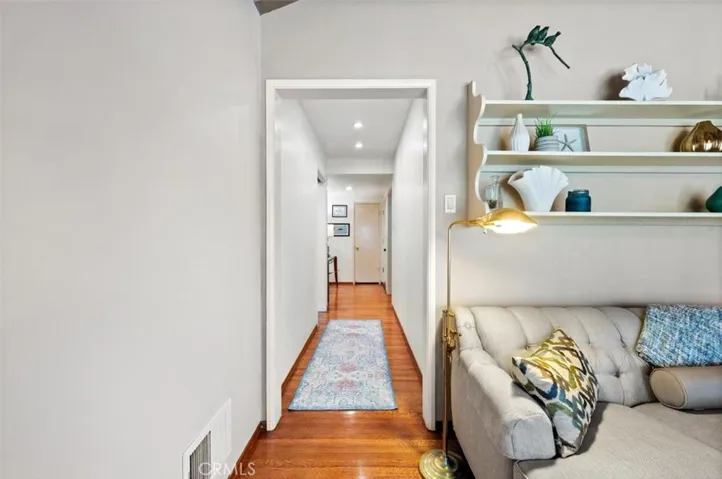 Looking back to the entry, hall to bedrooms to the right.