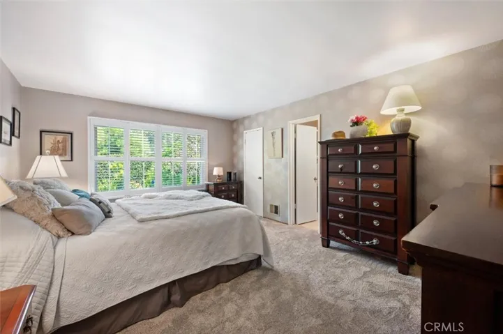 Main bedroom is good sized with a walk-in closet and private bath.