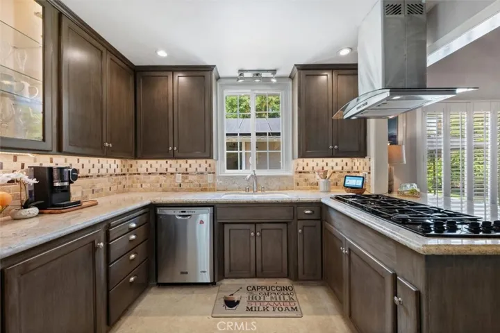 Remodeled kitchen with granite counters.