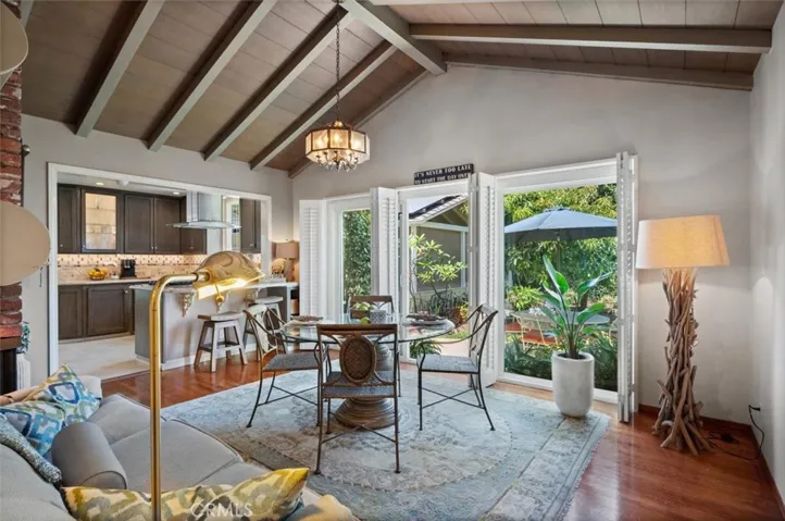 Family room with open beam vaulted ceilings-original to the house.