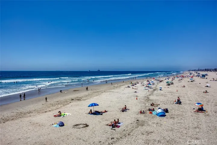 Get some sun and enjoy the sound of crashing waves on the wide beach.