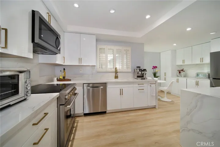 Stunning remodeled kitchen with high-end appliances and glossy lacquer cabinetry
