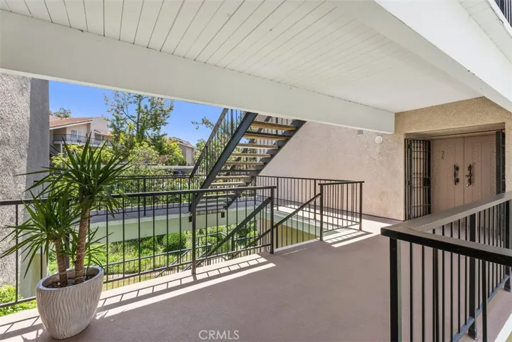 One of the set of stairs to second level closest to the condo.