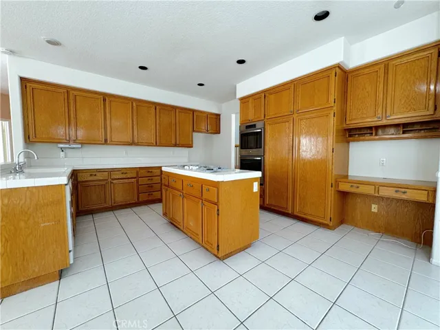 Cooks kitchen with desk area