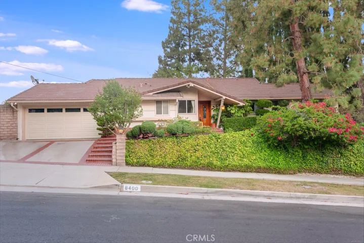 This VERY PRIVATE entertainers POOL HOME with mid-century modern flair and classic elegance is located on a quiet tree-lined street corner lot in one of West Hills most sought-after neighborhoods and sits on a HUGE 13,214 sq. ft. lot. The lush greenery, well-trimmed hedges, colorful flowerbeds, towering shade trees, pedestrian pathway and covered entry enhance its eye-catching curb appeal.