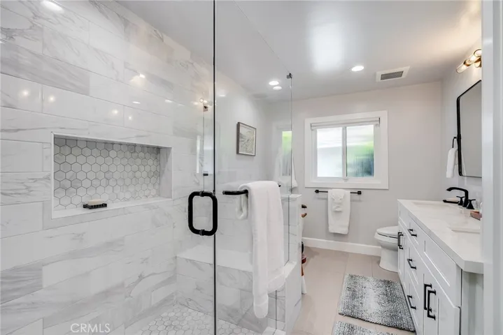 Hall bathroom. Separate bath and shower. Double sink.