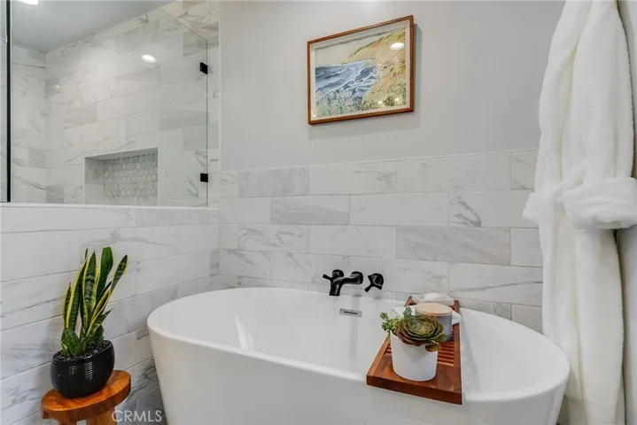 Hall bathroom with freestanding tub.