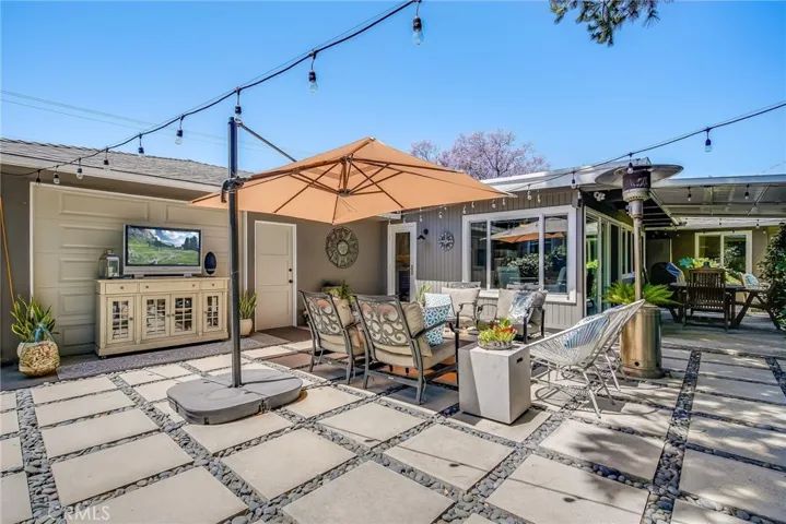 Patios. Garage to the left. There is a 2nd garage door that can be opened to the interior of the garage.